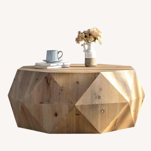 Used Amazon Sculptural Round Wood Coffee Table for sale on AptDeco
