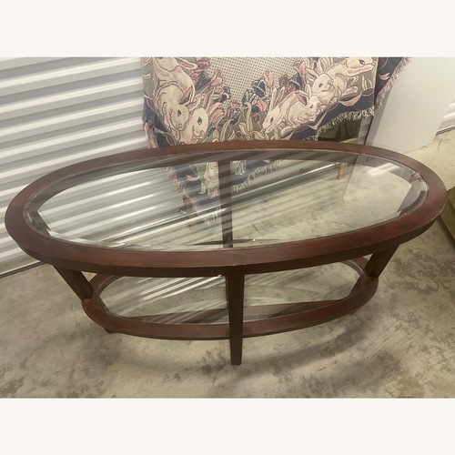 Used Ashley Furniture Dark Brown Wood Coffee Table for sale on AptDeco