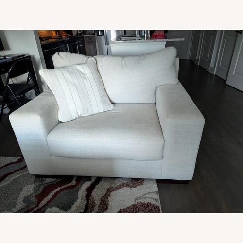 Used Ashley Furniture Modern Chair and a Half - Cream Color  for sale on AptDeco