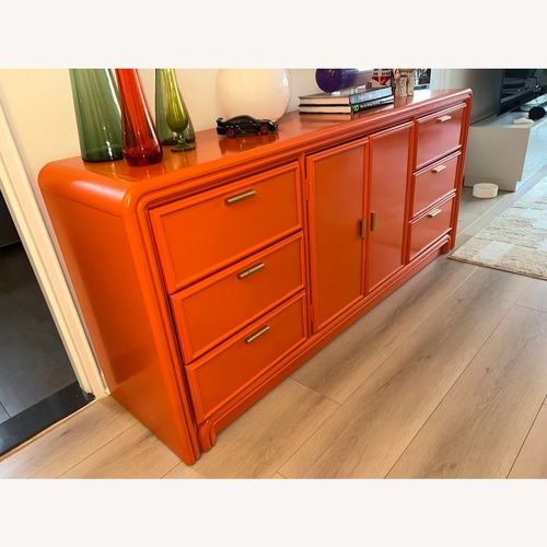 Used Vintage/Antique Orange Wood Sideboard for sale on AptDeco