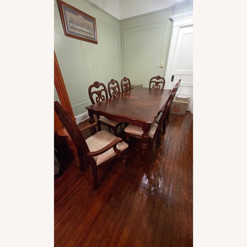 Used Dark Brown Wood Dining Set for sale on AptDeco