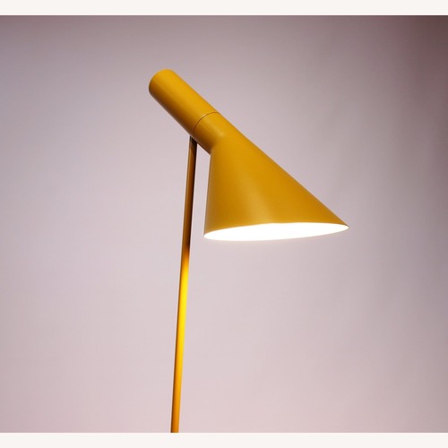 Used Arne Jacobsen Yellow Metal Floor Lamp for sale on AptDeco