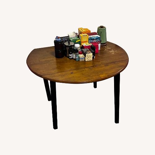 Used Light Brown Wood Dining Table for sale on AptDeco