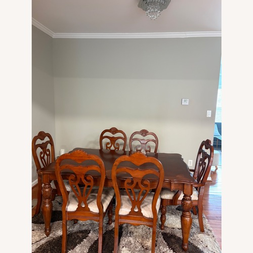 Used A&E Wood Designs Dark Brown Wood Dining Table for sale on AptDeco