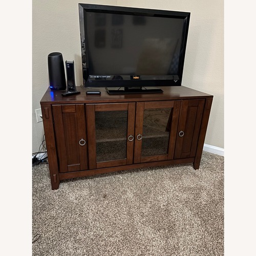 Used Dark Brown Wood TV Stand  for sale on AptDeco