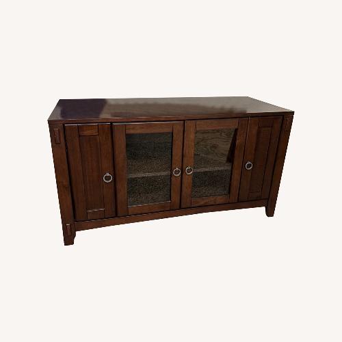 Used Dark Brown Wood TV Stand  for sale on AptDeco