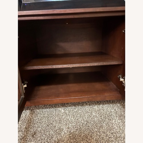 Used Dark Brown Wood TV Stand  for sale on AptDeco