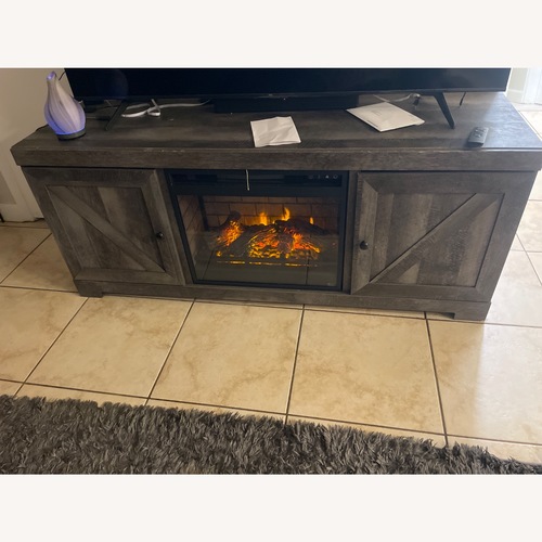 Used Ashley Furniture Wynnlow Light Brown Wood Media Storage for sale on AptDeco