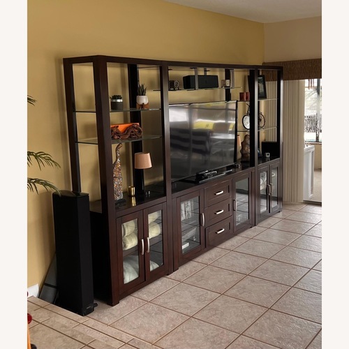 Used Rooms To Go TV Wall Entertainment Center in Dark Wood for sale on AptDeco