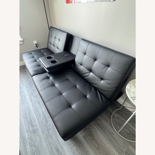 Used Black Faux Leather Futon for sale on AptDeco