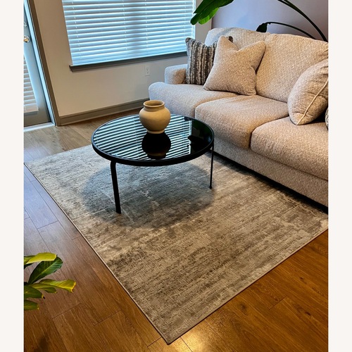 Used Ashley Furniture Area Rug 65' x 90' for sale on AptDeco