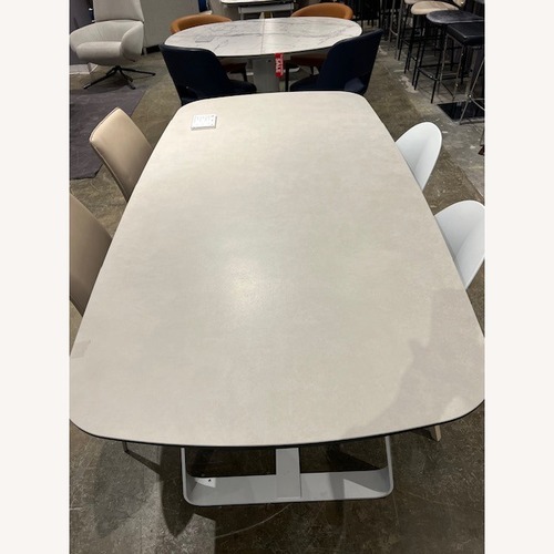 Used Calligaris Sunshine Natural Ceramic Dining Table for sale on AptDeco