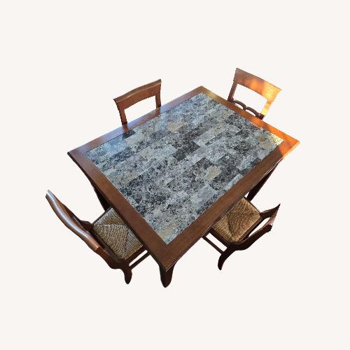 Used Dark Brown Wood Dining Table and Chairs for sale on AptDeco