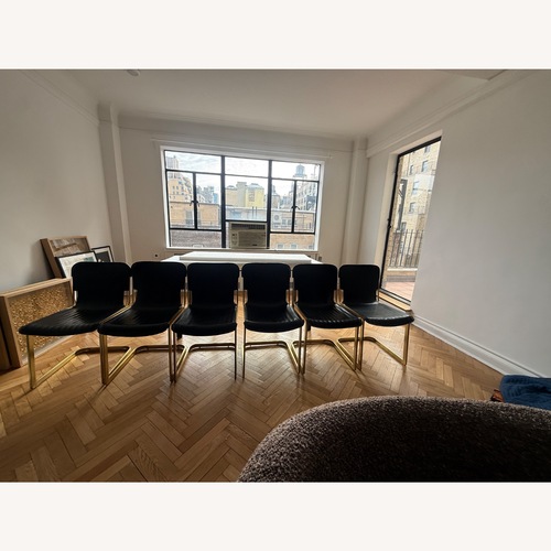 Used CB2 6 Rake Black Leather Dining Chairs for sale on AptDeco