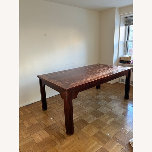 Used Antique Dark Brown Wood Dining Table for sale on AptDeco