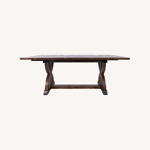 Used Raymour & Flanigan Dark Brown Solid Wood Expandable Dining Table for sale on AptDeco