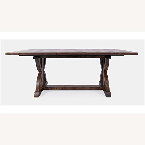 Used Raymour & Flanigan Dark Brown Solid Wood Expandable Dining Table for sale on AptDeco