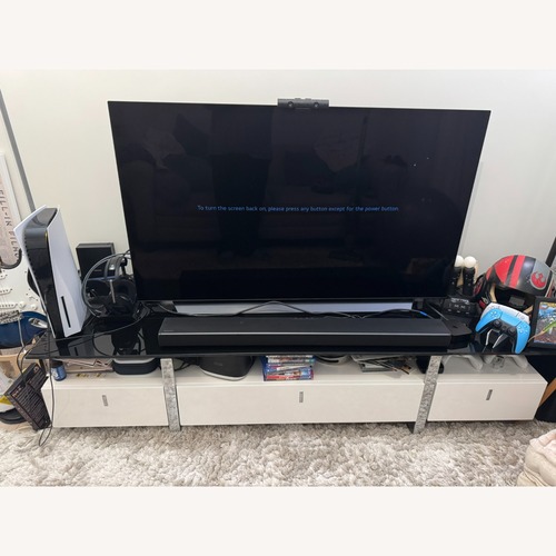Used Comfyco White TV Stand with Glass Top and Storage Space for sale on AptDeco