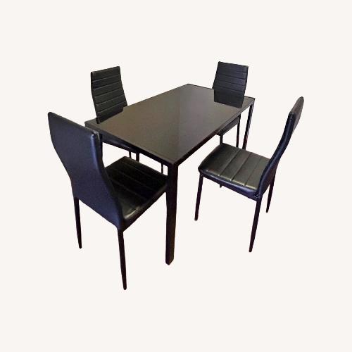 Used Entree Casual Dining Black Dining Table for sale on AptDeco