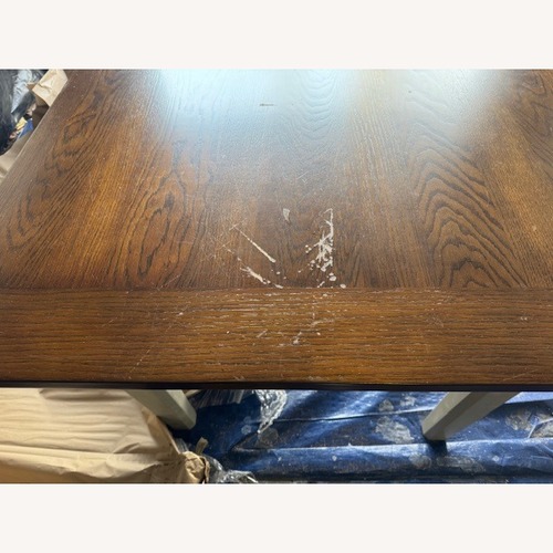 Used Dark Brown Wood Dining Set for sale on AptDeco