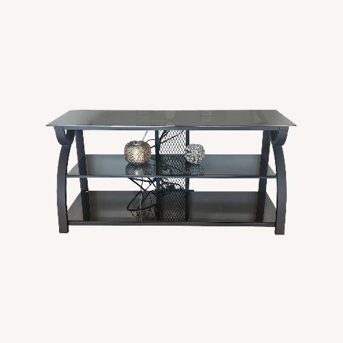 Used Black Glass TV Stand for sale on AptDeco
