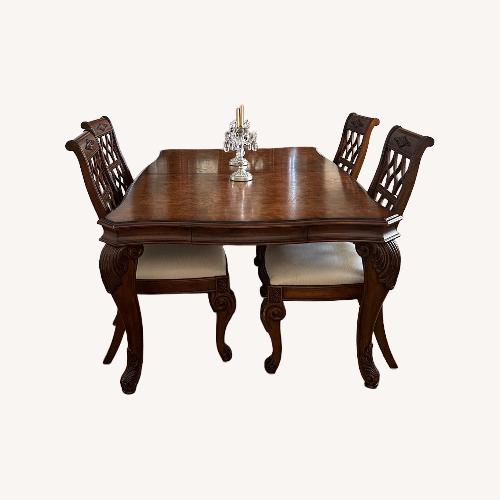 Used Robb & Stucky Interiors Dining Table for sale on AptDeco