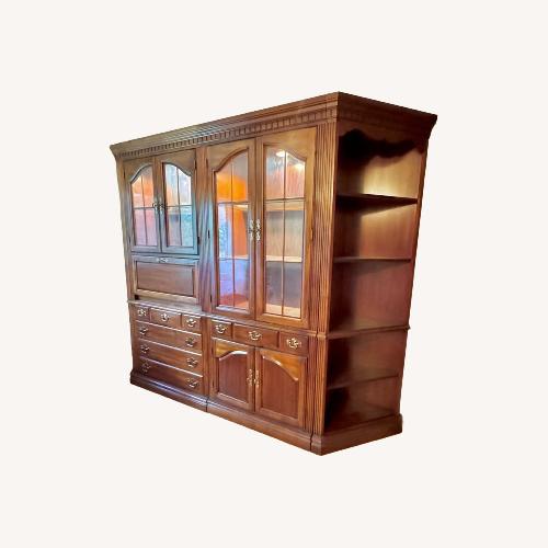 Used Dark Brown Wood Armoire for sale on AptDeco