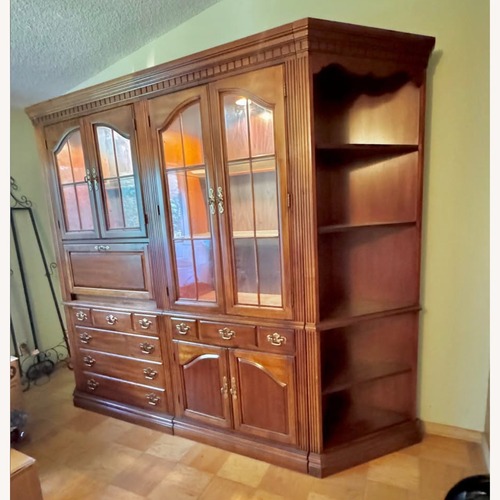 Used Dark Brown Wood Armoire for sale on AptDeco