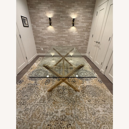 Used Emiliano by Wade Logan Gold Glass Dining Table for sale on AptDeco