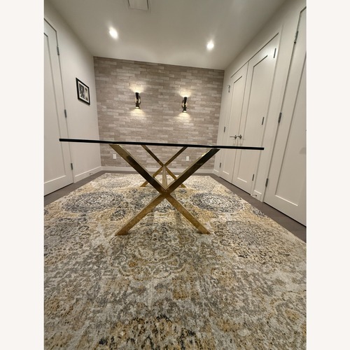 Used Emiliano by Wade Logan Gold Glass Dining Table for sale on AptDeco