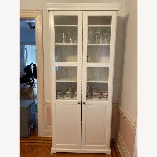 Used IKEA LIATORP Bookcase with Glass Doors in White for sale on AptDeco