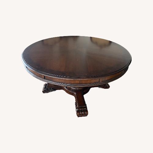 Used Dark Brown Wood Dining Table for sale on AptDeco