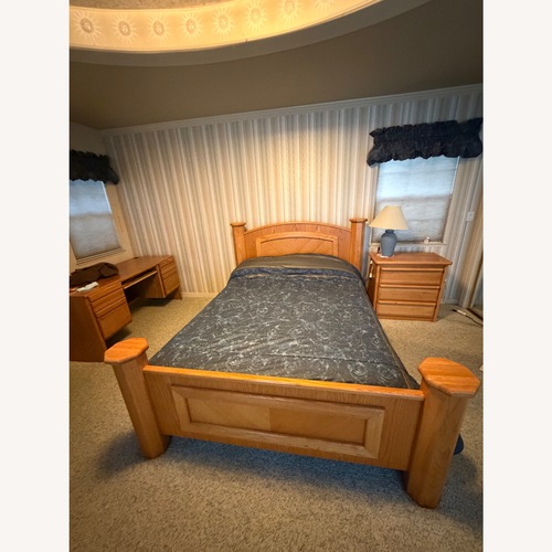Used Light Brown Wood Queen Bed for sale on AptDeco