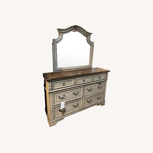 Used Ashley Lodenbay Two-Tone 7-Drawer Dresser with Mirror for sale on AptDeco