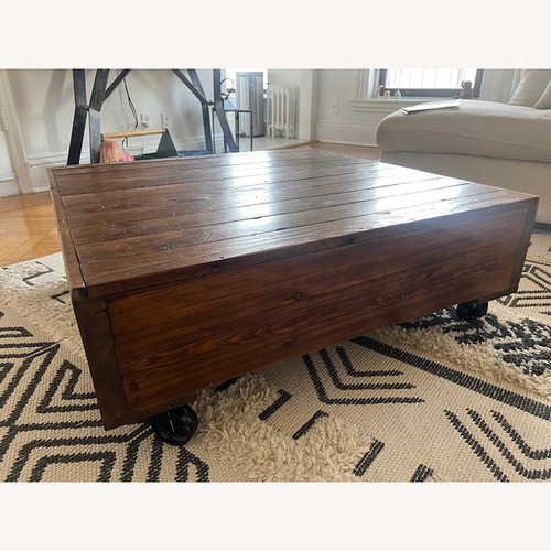 Used Etsy Dark Brown Wood Coffee Table for sale on AptDeco