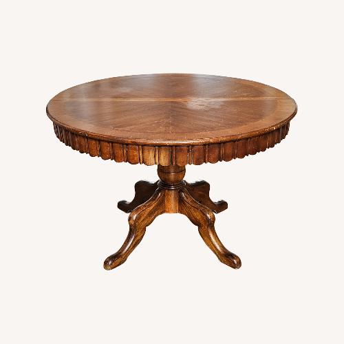 Used Round to Oval Walnut Extendable Dining Table for sale on AptDeco