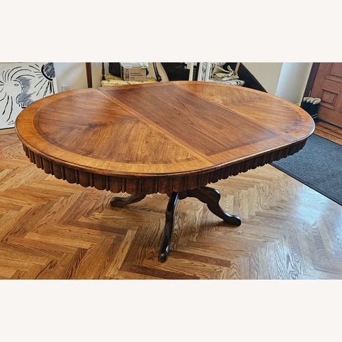 Used Round to Oval Walnut Extendable Dining Table for sale on AptDeco