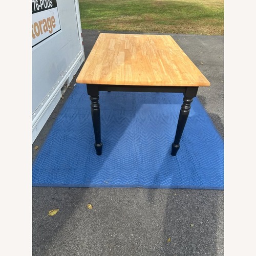 Used Natural Wood Dining Table for sale on AptDeco