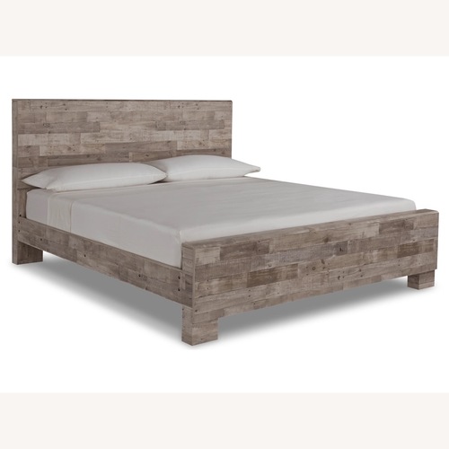 Used Ashley Effie Collection Natural Wood King Bed for sale on AptDeco