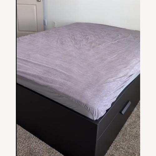 Used IKEA Black Wood Queen Bed for sale on AptDeco
