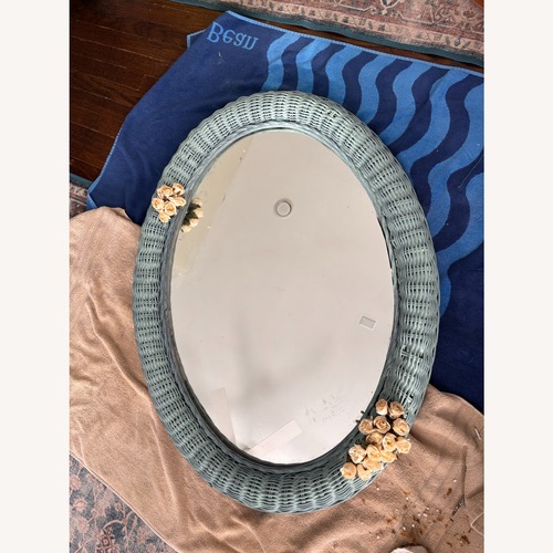 Used Light Teal Wicker Mirror with White Rose Accents for sale on AptDeco