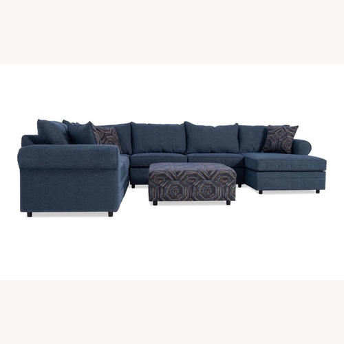 Used Juno Denim 142'' 4 Piece Chaise Sectional with Ottoman for sale on AptDeco