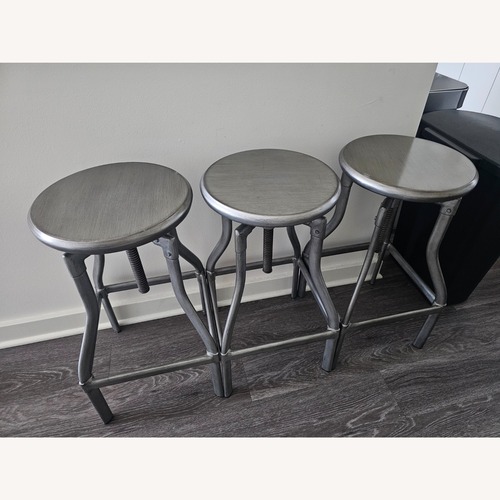 Used Crate & Barrel Silver Adjustable Metal Stools for sale on AptDeco