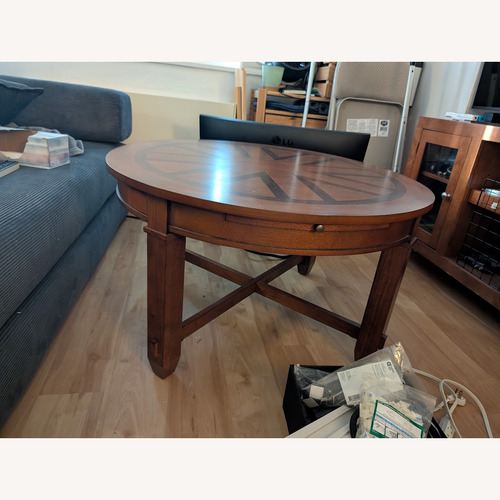 Used Raymour & Flanigan Sunburst Wood Coffee Table for sale on AptDeco