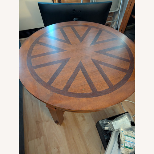 Used Raymour & Flanigan Sunburst Wood Coffee Table for sale on AptDeco