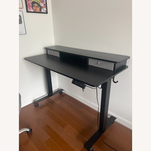 Used FEZIBO Black Standing Desk  for sale on AptDeco