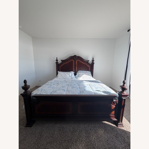 Used Rooms To Go Cortinella Wood King Bed for sale on AptDeco