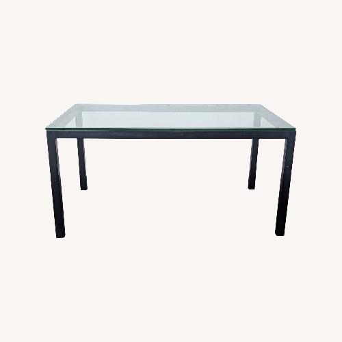 Used Crate & Barrel Glass Top Parsons Dining Table for sale on AptDeco