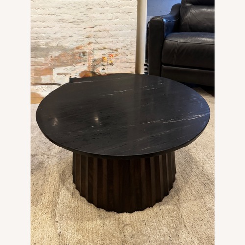 Used Ashley Furniture Ceilby Black Marble Coffee Table for sale on AptDeco
