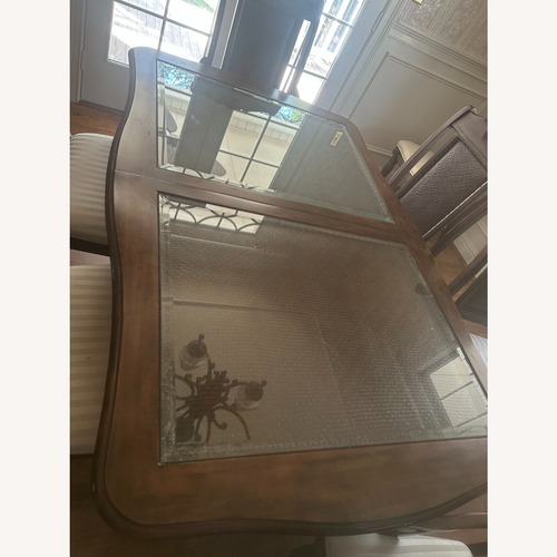 Used Wood and Glass Dining Table with 8 Chairs for sale on AptDeco